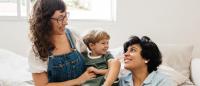 lesbian couple playing with their child